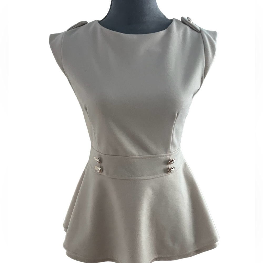 Beige peplum top. Size M